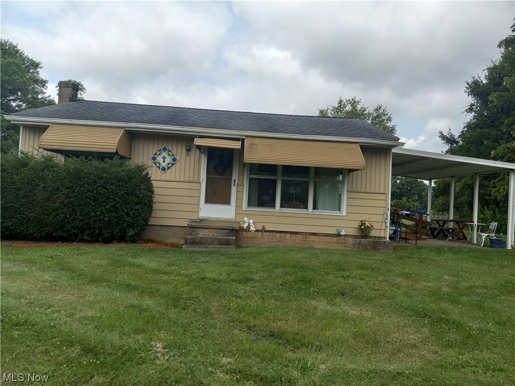 71695 Old Twenty One Road Kimbolton, OH 43749 - Photo 1 of 19 Front view of home with car port.