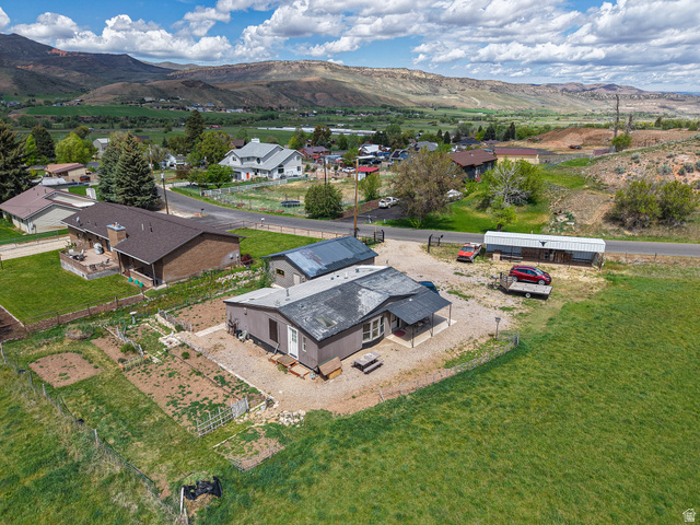 94 Spring Canyon Road Coalville, UT 84017 - Photo 2 of 50 Single-story property with a covered porch and gravel driveway