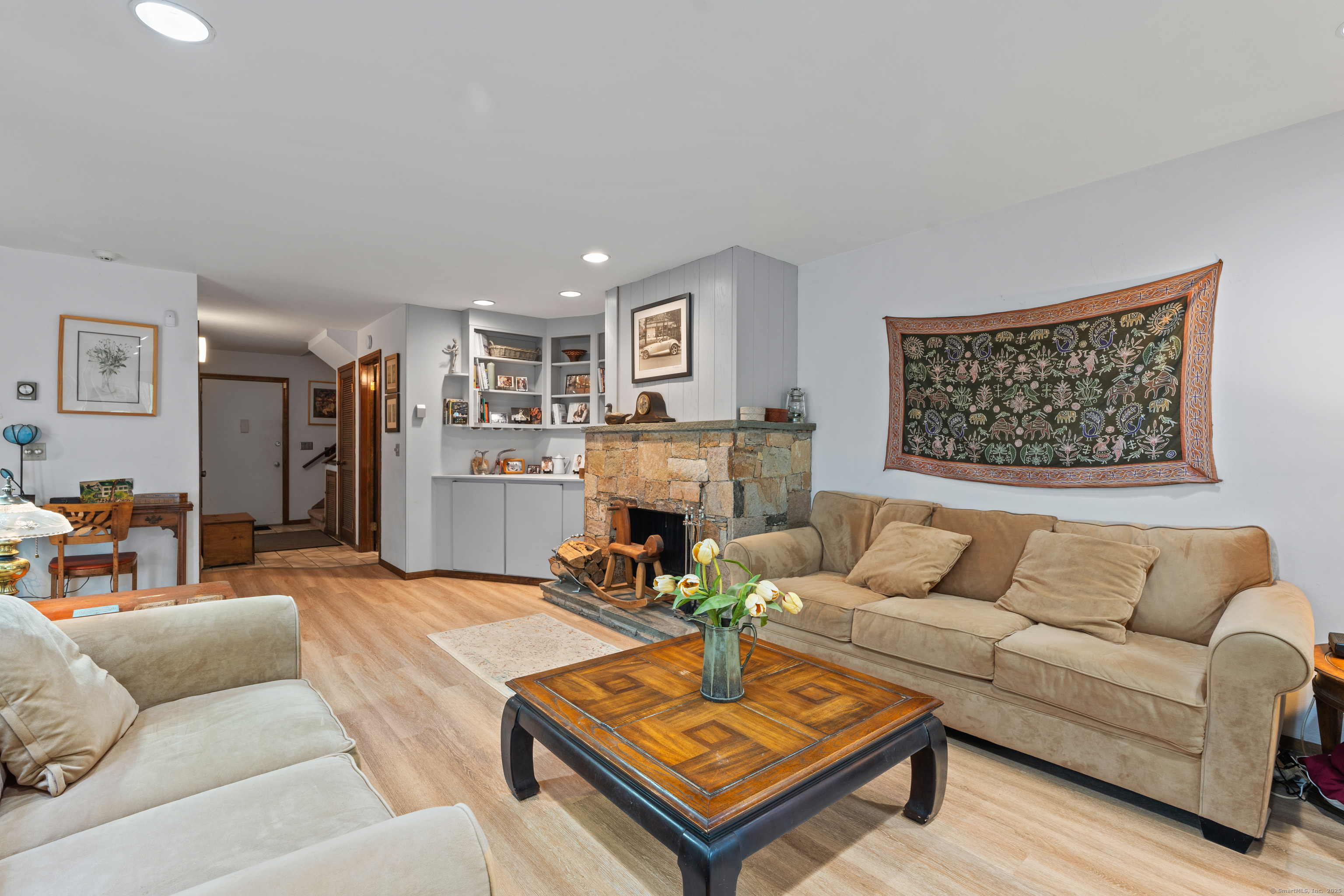 90 Woodside Circle Torrington, CT 06790 - Photo 1 of 1 a living room with furniture a table and a wall painting