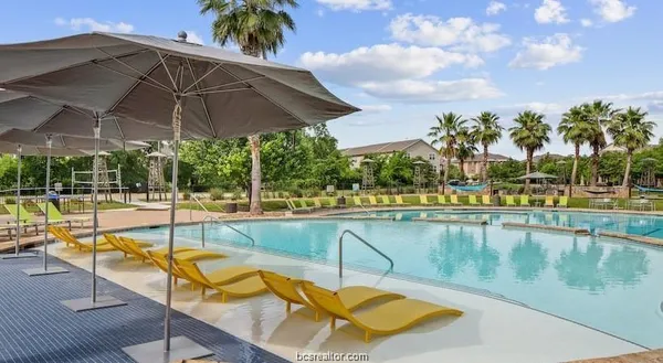 a view of a swimming pool with a patio