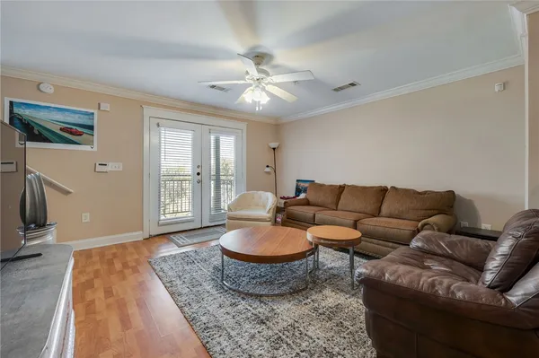 a living room with furniture and a rug
