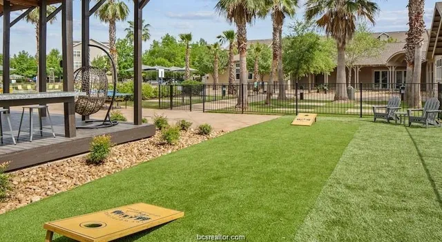 a view of a park with palm trees