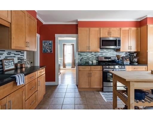37 Bluff Road Weymouth, MA 02191 - Photo 5 of 21 a kitchen with stainless steel appliances granite countertop a stove top oven a sink a dining table and chairs