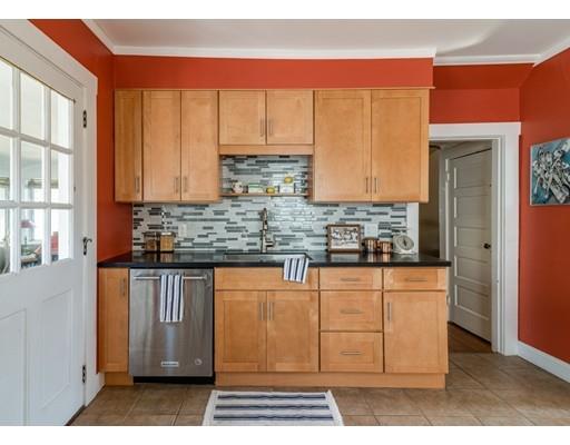 37 Bluff Road Weymouth, MA 02191 - Photo 6 of 21 a kitchen with stainless steel appliances granite countertop a stove a sink and a microwave