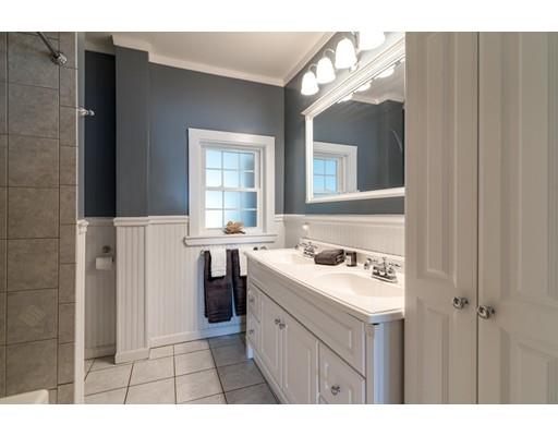 37 Bluff Road Weymouth, MA 02191 - Photo 9 of 21 a bathroom with a sink a toilet and a mirror