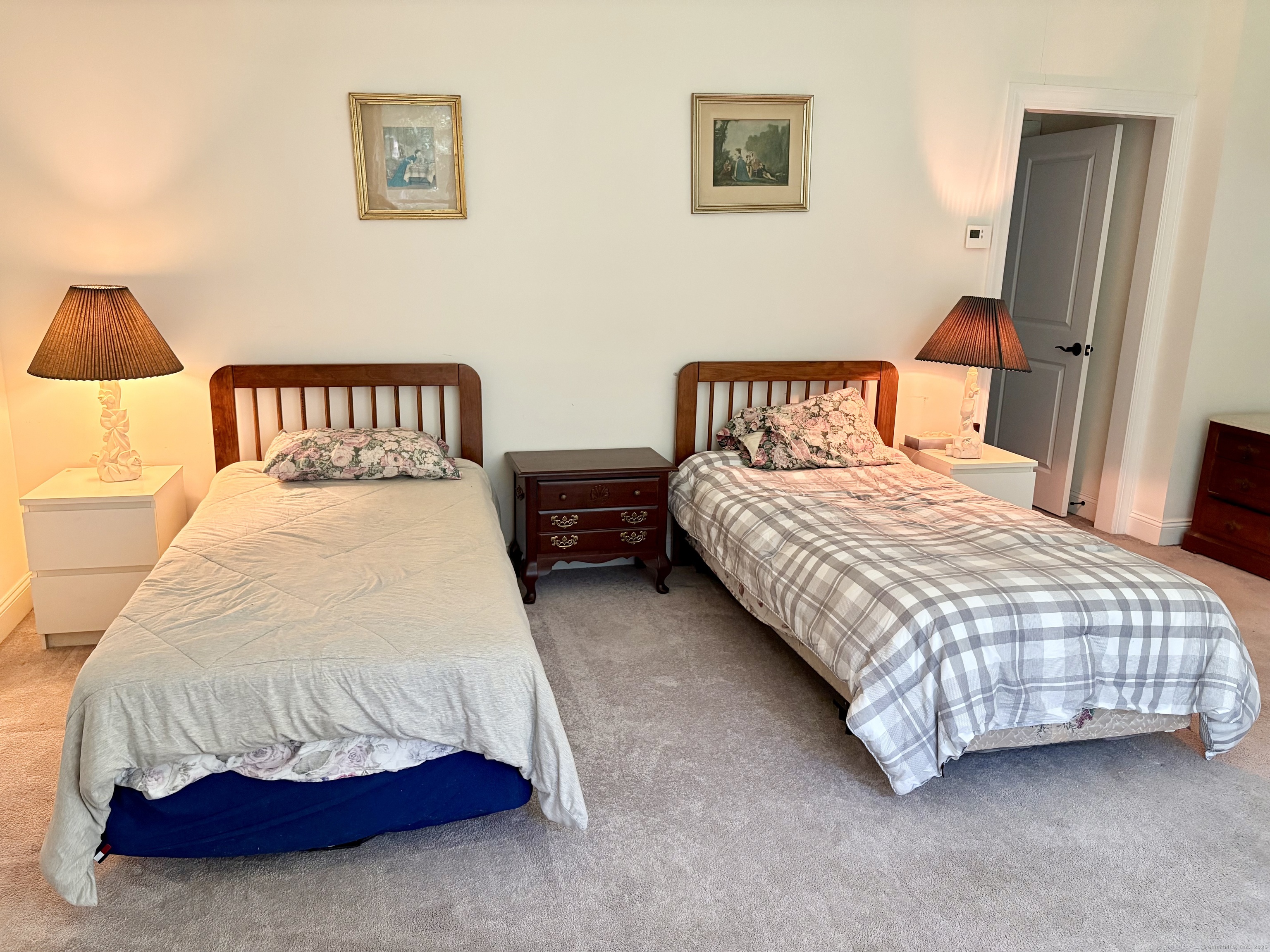 47 Sherwood Street, Unit 47 Mansfield, CT 06268 - Photo 17 of 21 a bedroom with a bed and a painting on the wall