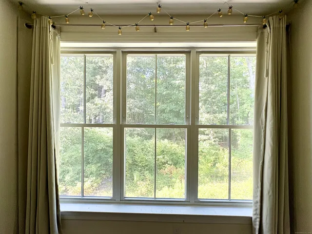 a view of a living room with a large window