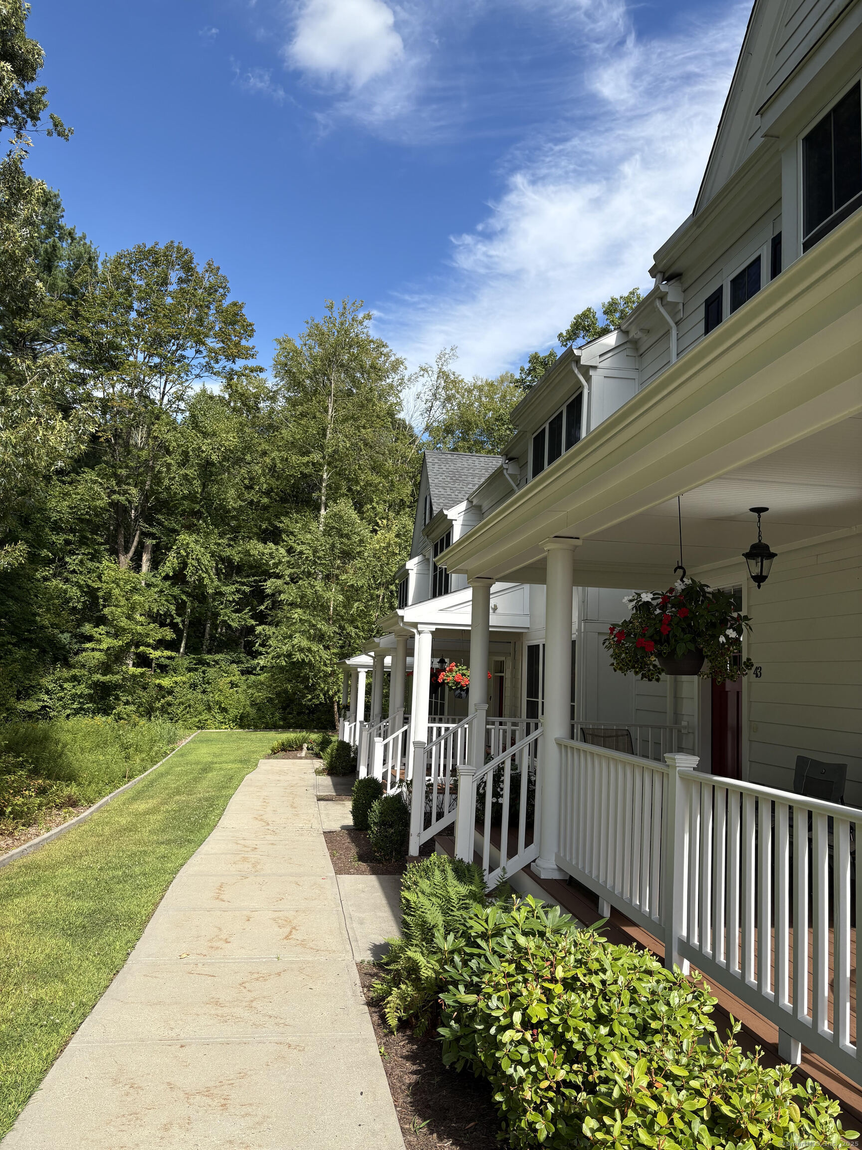 47 Sherwood Street, Unit 47 Mansfield, CT 06268 - Photo 2 of 21 a view of a garden with pathway