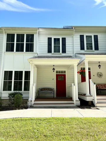 a view of building with car parked