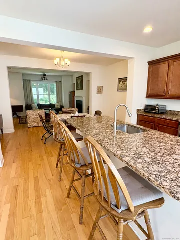 a view of a living room and kitchen counter space