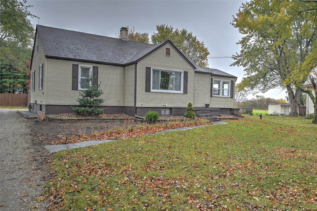 1460 West Ash Avenue Decatur, IL 62526 - Photo 18 of 24 a front view of house with yard and trees around