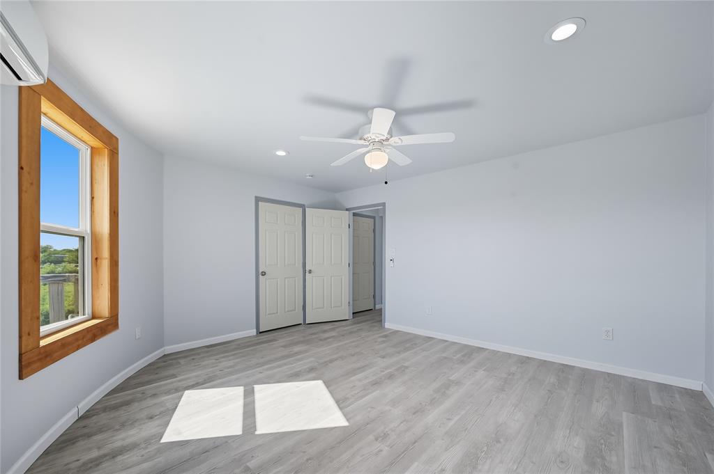 9833 Private Rd. 5377 Nevada, TX 75173 - Photo 18 of 40 wooden floor in an empty room with a window
