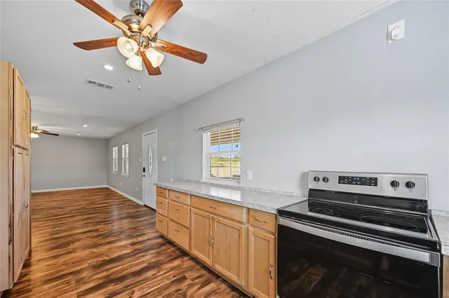 a kitchen with a stove and a microwave