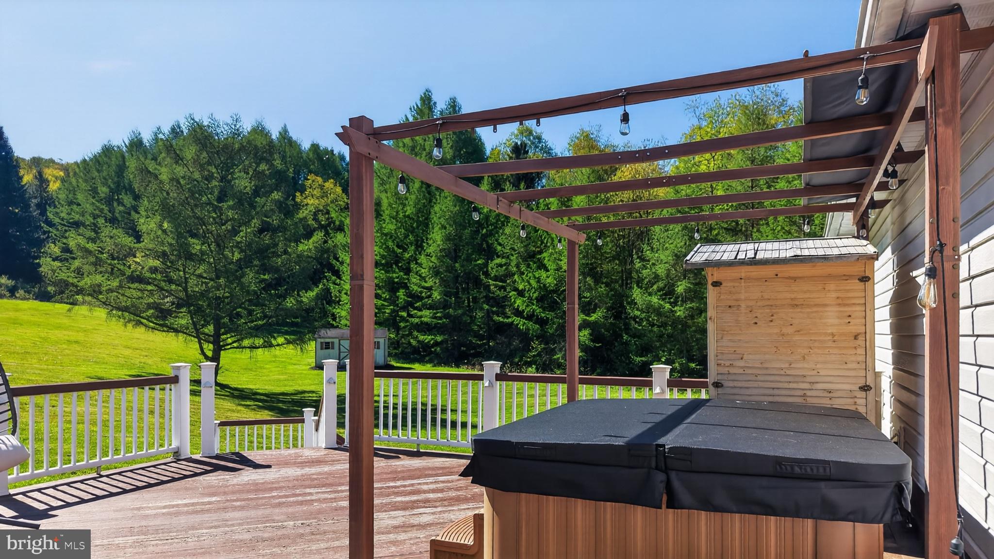 259 A A-Frame Road Coudersport, PA 16915 - Photo 90 of 130 Serene deck with lush green backdrop.
