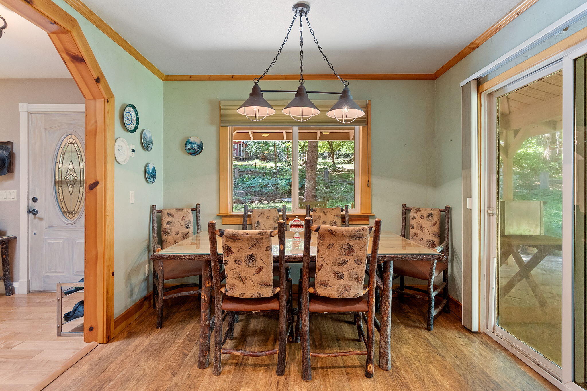 30303 Oak Run To Fern Road Whitmore, CA 96096 - Photo 11 of 75 a dining room with a glass top table and chairs