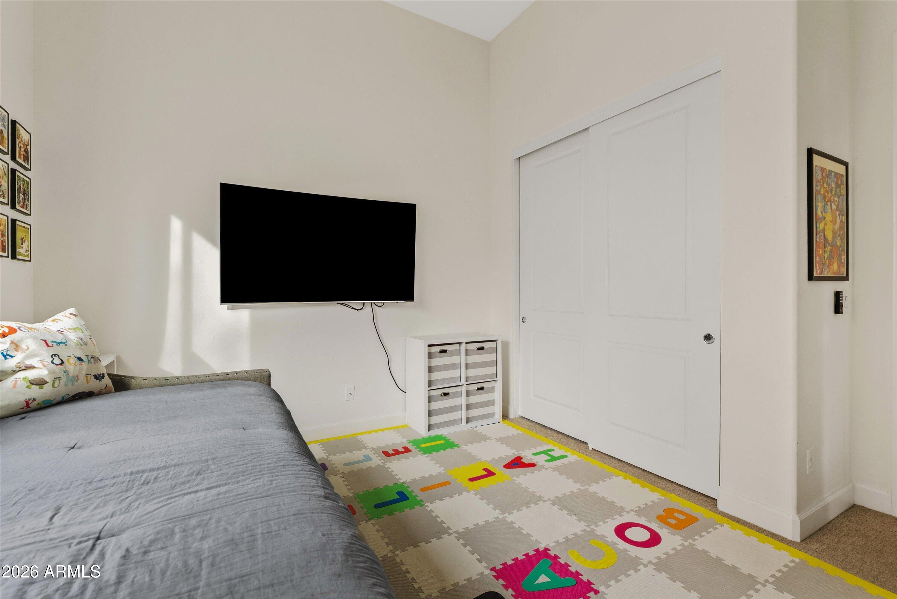 7002 South Portland Avenue Gilbert, AZ 85298 - Photo 22 of 40 a living room with furniture and a flat screen tv