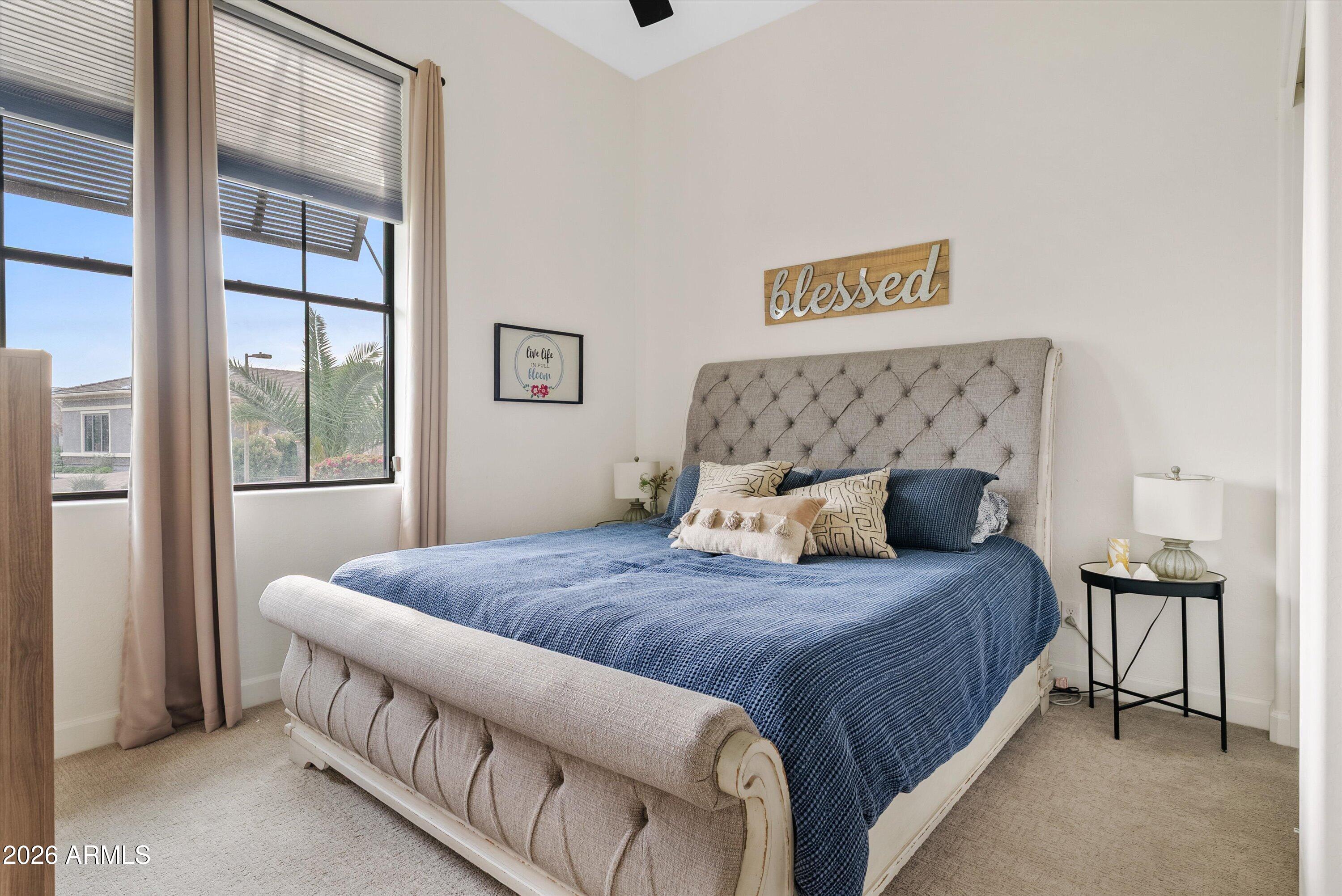7002 South Portland Avenue Gilbert, AZ 85298 - Photo 26 of 40 a bedroom with a bed and a large window