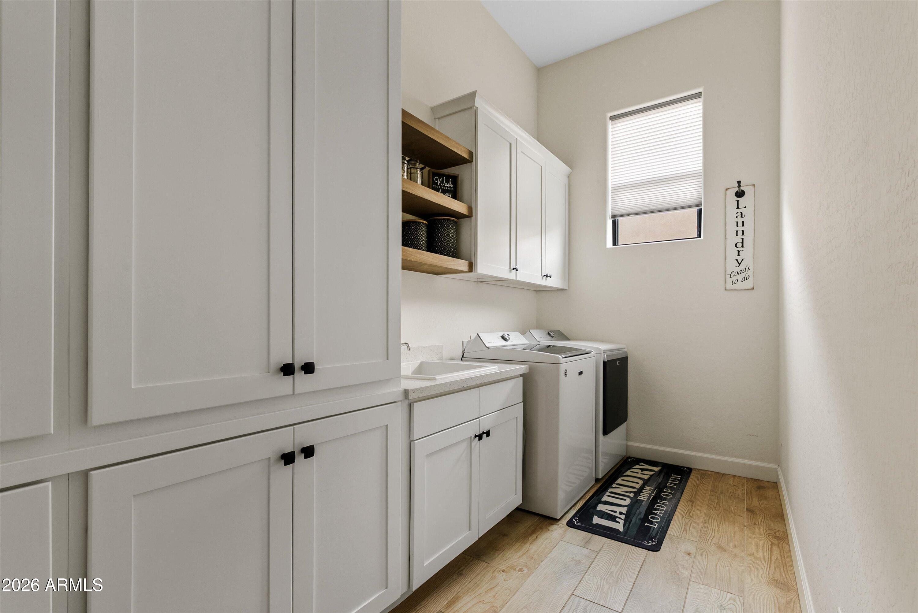 7002 South Portland Avenue Gilbert, AZ 85298 - Photo 33 of 40 a room with a sink and cabinets