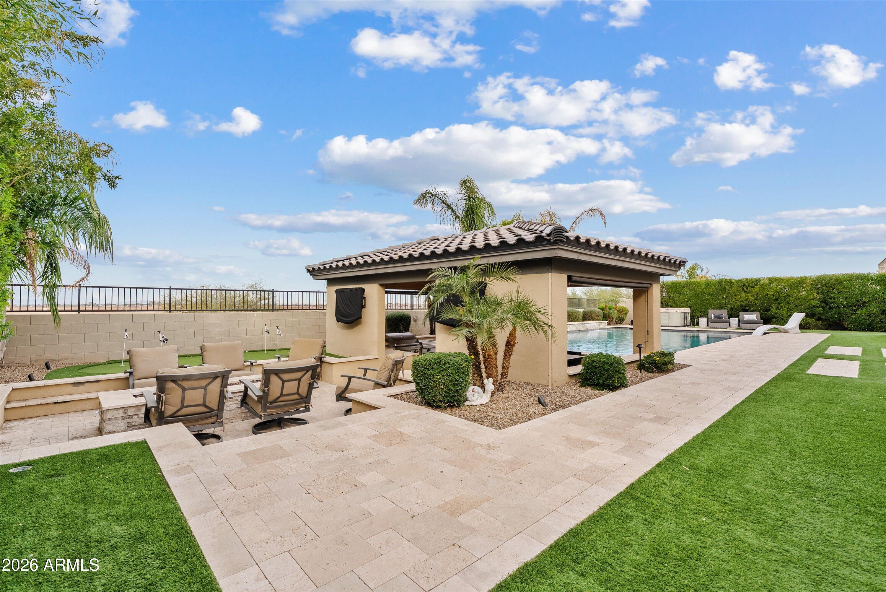 7002 South Portland Avenue Gilbert, AZ 85298 - Photo 39 of 40 a view of a house with backyard porch and sitting area