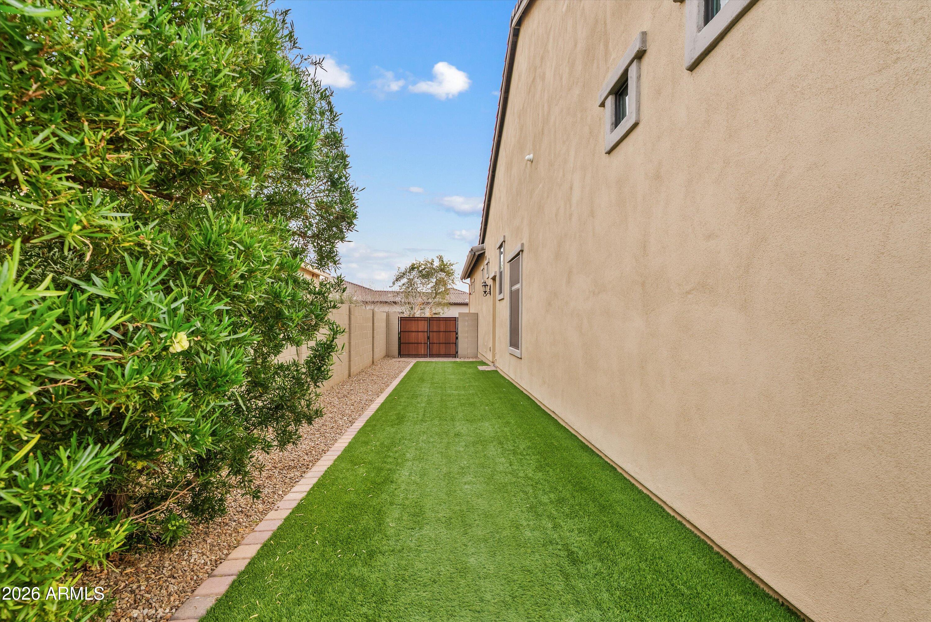 7002 South Portland Avenue Gilbert, AZ 85298 - Photo 40 of 40 a view of a backyard with potted plants