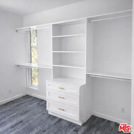 a view of an empty walk in closet