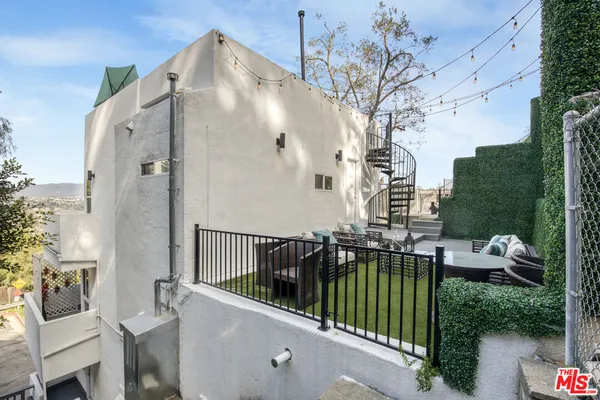 a view of balcony with furniture