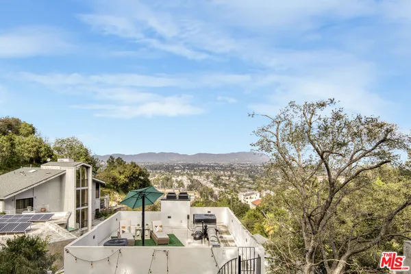 a view of a terrace with a mountain