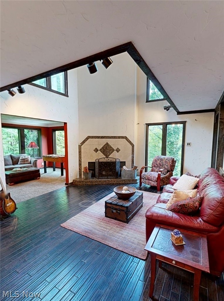 2868 Shade Road Akron, OH 44333 - Photo 47 of 49 Vaulted ceiling with exposed dark wood beams and track lighting