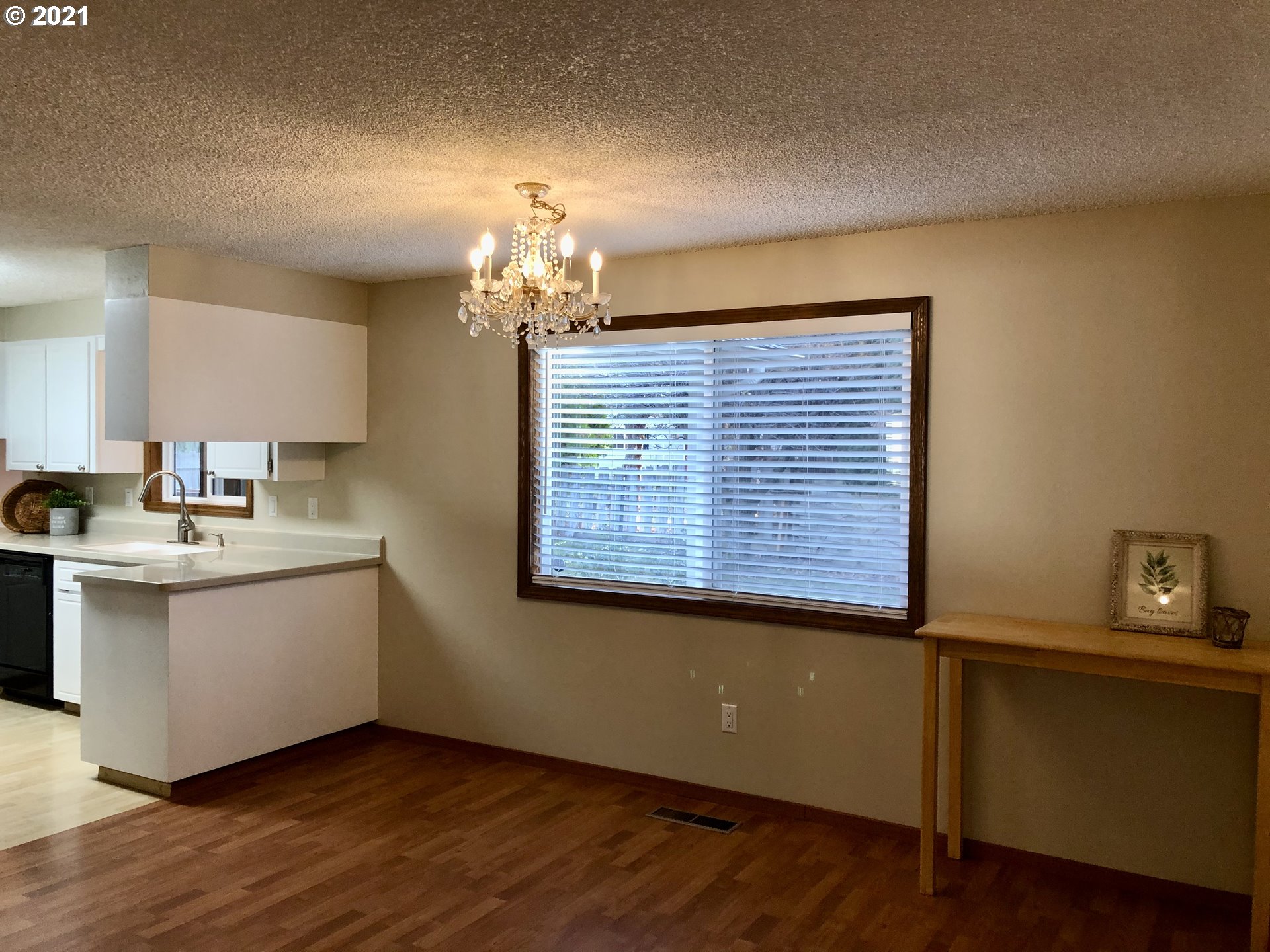 4520 Southwest Olson Avenue Pendleton, OR 97801 - Photo 3 of 22 a view of a room with wooden floor and sink