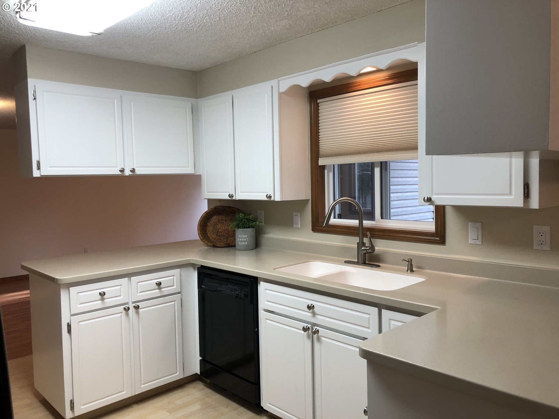 4520 Southwest Olson Avenue Pendleton, OR 97801 - Photo 4 of 22 a kitchen with white cabinets and sink