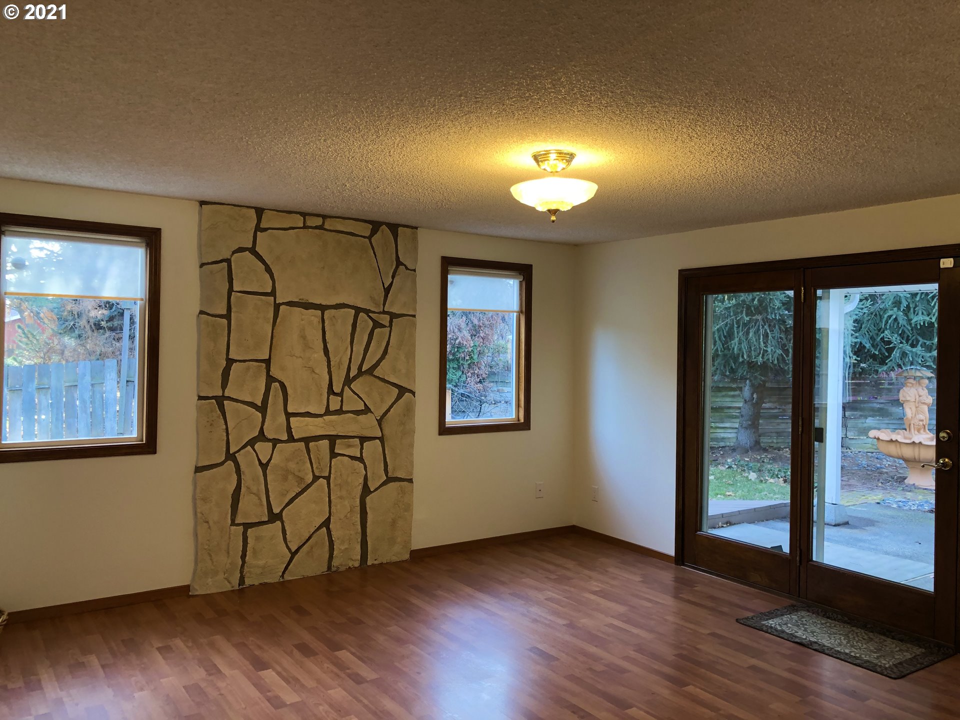 4520 Southwest Olson Avenue Pendleton, OR 97801 - Photo 7 of 22 a view of an empty room with wooden floor and a window
