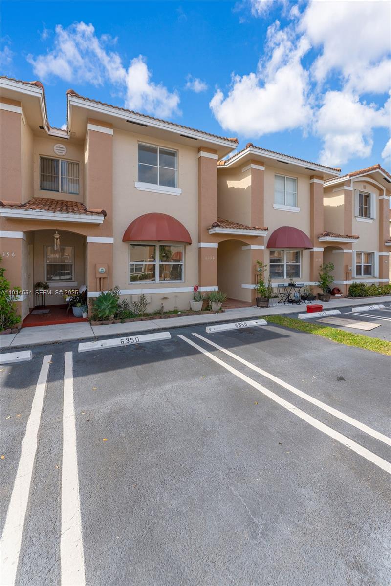 6350 Southwest 139th Avenue Miami, FL 33183 - Photo 3 of 37 a city street lined with buildings and cars