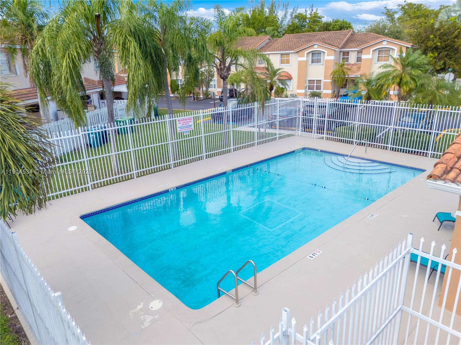 6350 Southwest 139th Avenue Miami, FL 33183 - Photo 37 of 37 a view of a swimming pool with a patio and a yard