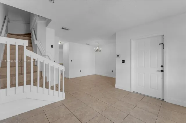 a kitchen with cabinets and white stainless steel appliances