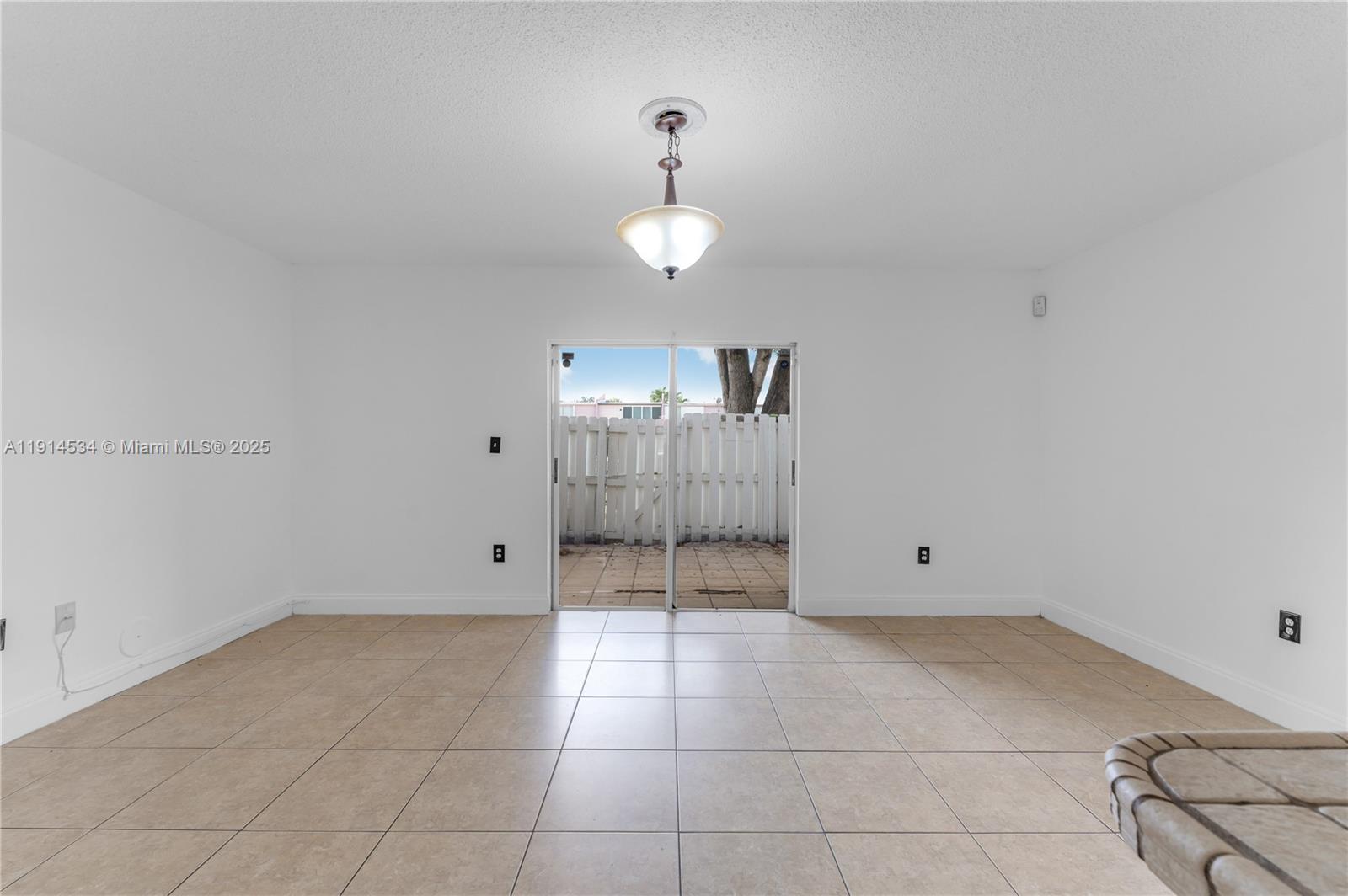 6350 Southwest 139th Avenue Miami, FL 33183 - Photo 9 of 37 a view of an empty room with a window