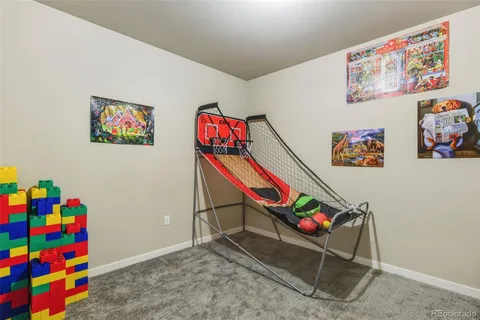 a room with toys and wall picture