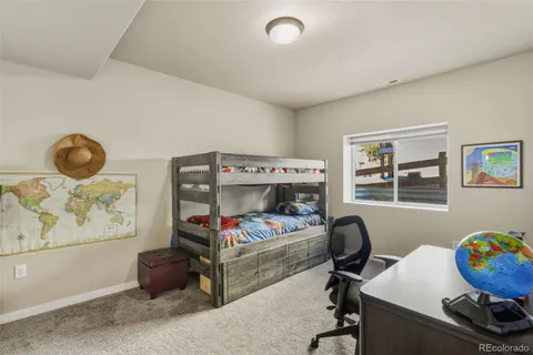 a bedroom with a workspace