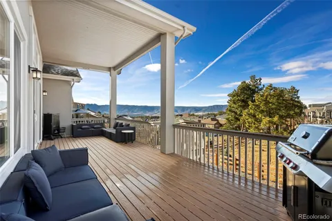 a view of a balcony with furniture