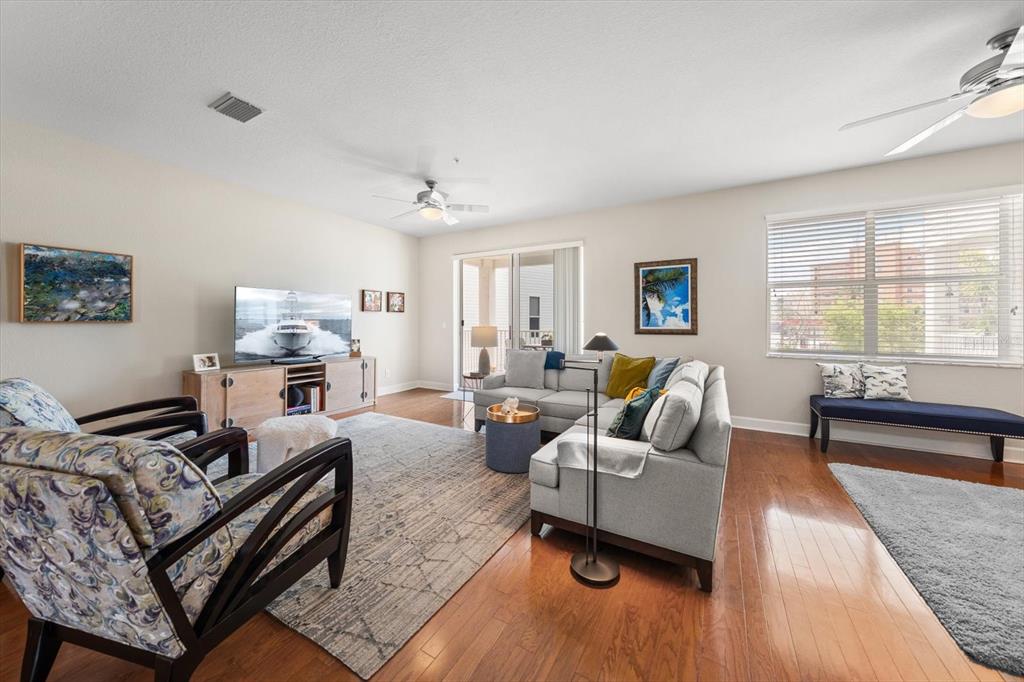 103 Shoals Circle North Redington Beach, FL 33708 - Photo 21 of 69 a living room with furniture and a wooden floor