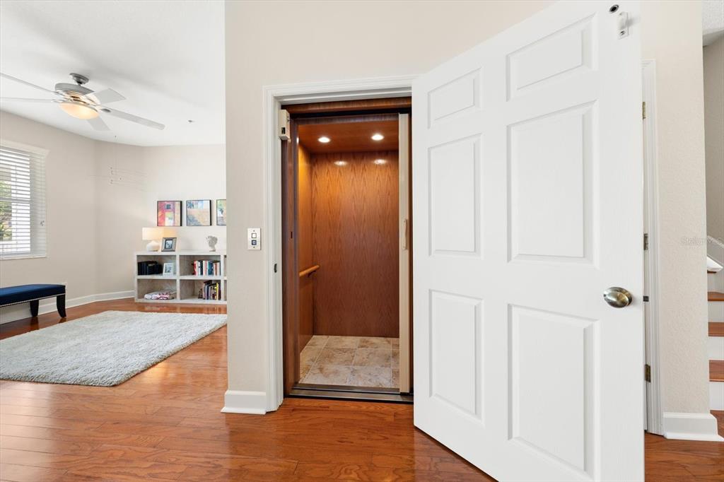 103 Shoals Circle North Redington Beach, FL 33708 - Photo 24 of 69 a view of a hallway view with wooden floor and staircase