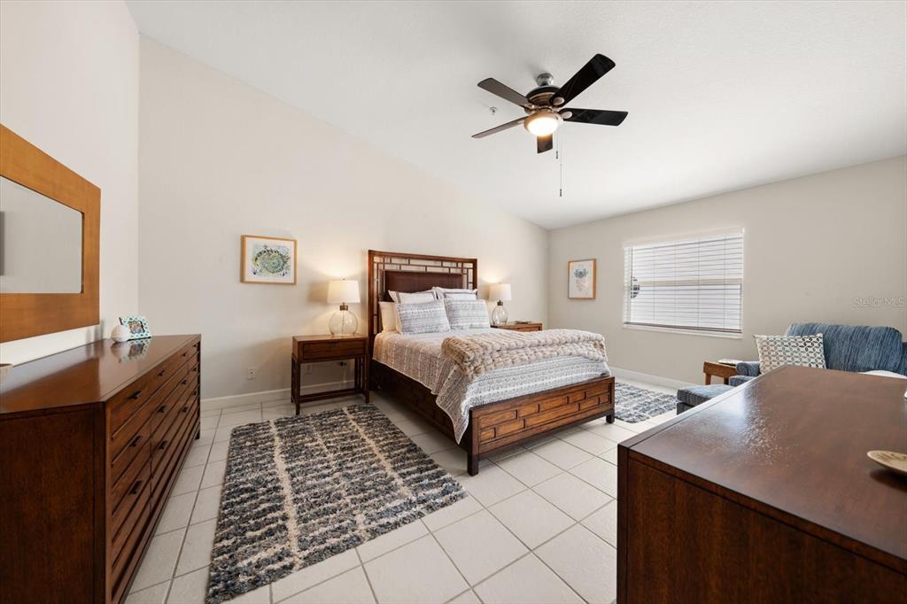 103 Shoals Circle North Redington Beach, FL 33708 - Photo 27 of 69 a bedroom with two beds and a dresser