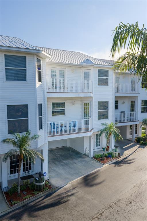 103 Shoals Circle North Redington Beach, FL 33708 - Photo 3 of 69 a front view of a house with a yard
