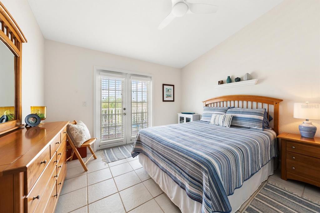 103 Shoals Circle North Redington Beach, FL 33708 - Photo 40 of 69 a bedroom with a bed and a window