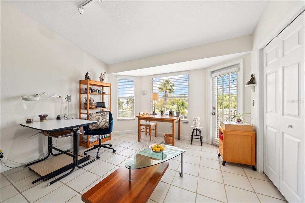 103 Shoals Circle North Redington Beach, FL 33708 - Photo 45 of 69 a living room with furniture and a table
