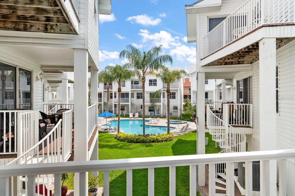 103 Shoals Circle North Redington Beach, FL 33708 - Photo 6 of 69 a view of a large building with a porch