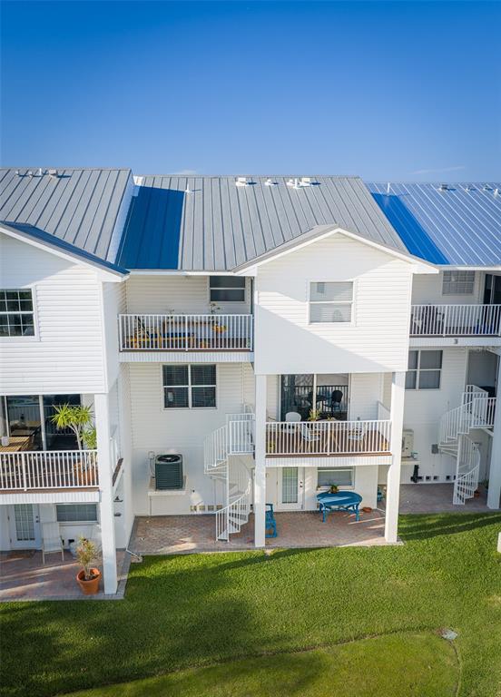103 Shoals Circle North Redington Beach, FL 33708 - Photo 67 of 69 a front view of a house with a garden
