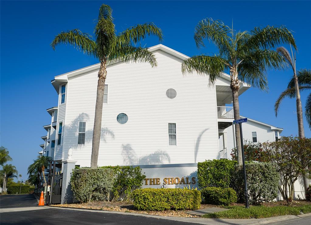 103 Shoals Circle North Redington Beach, FL 33708 - Photo 68 of 69 a view of a house with a palm tree