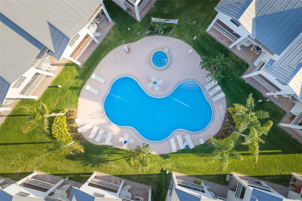 103 Shoals Circle North Redington Beach, FL 33708 - Photo 7 of 69 an aerial view of a house with a swimming pool and outdoor space
