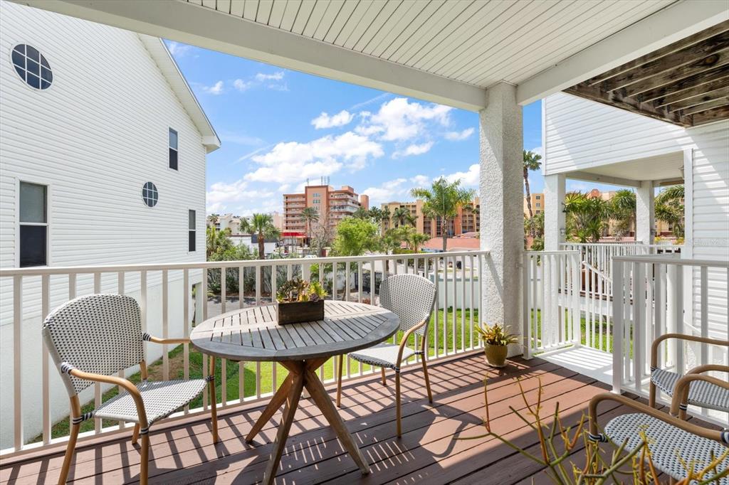 103 Shoals Circle North Redington Beach, FL 33708 - Photo 8 of 69 a view of a chairs and table in patio
