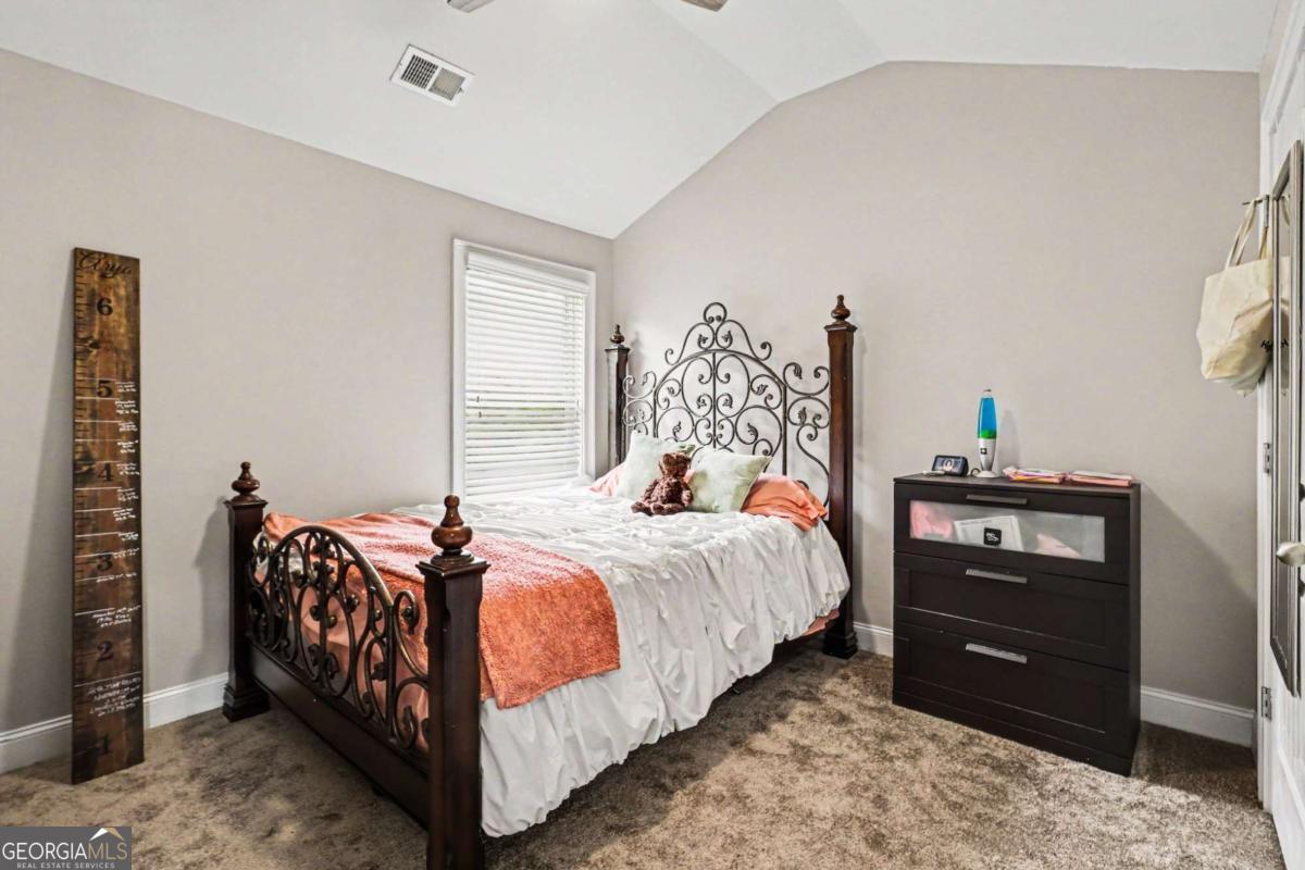 207 George Wynn Road Palmetto, GA 30268 - Photo 20 of 32 a bedroom with a bed and a closet